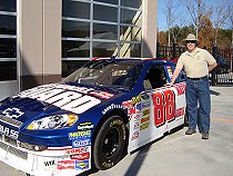 Posing with one of Dale Jr's cars before event started